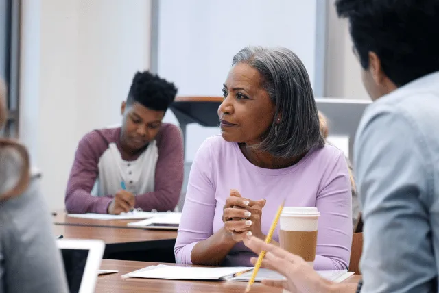 Woman sitting on desk