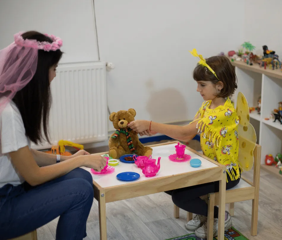Therapist and young girl interacting in Theraplay session