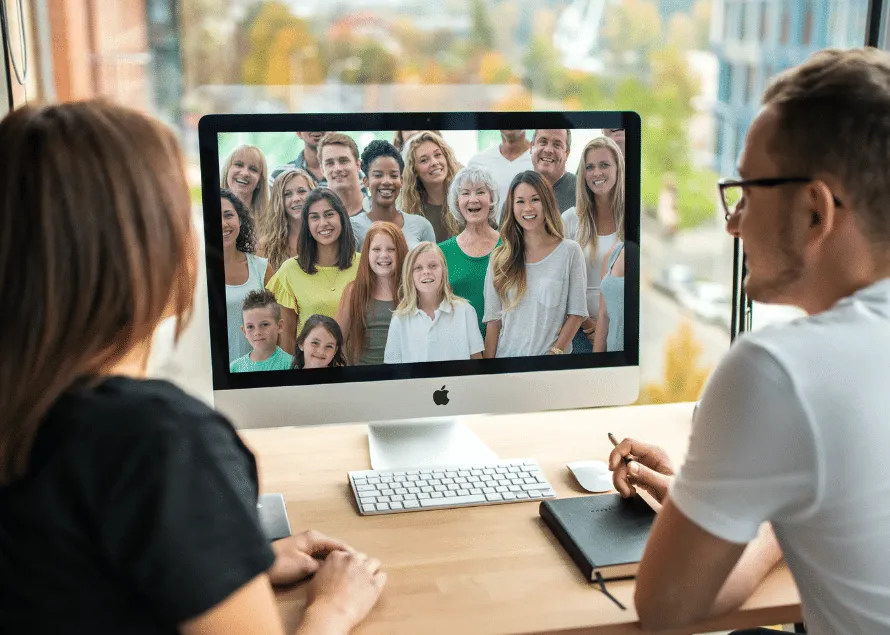 Wife & Husband watching webinar on computer