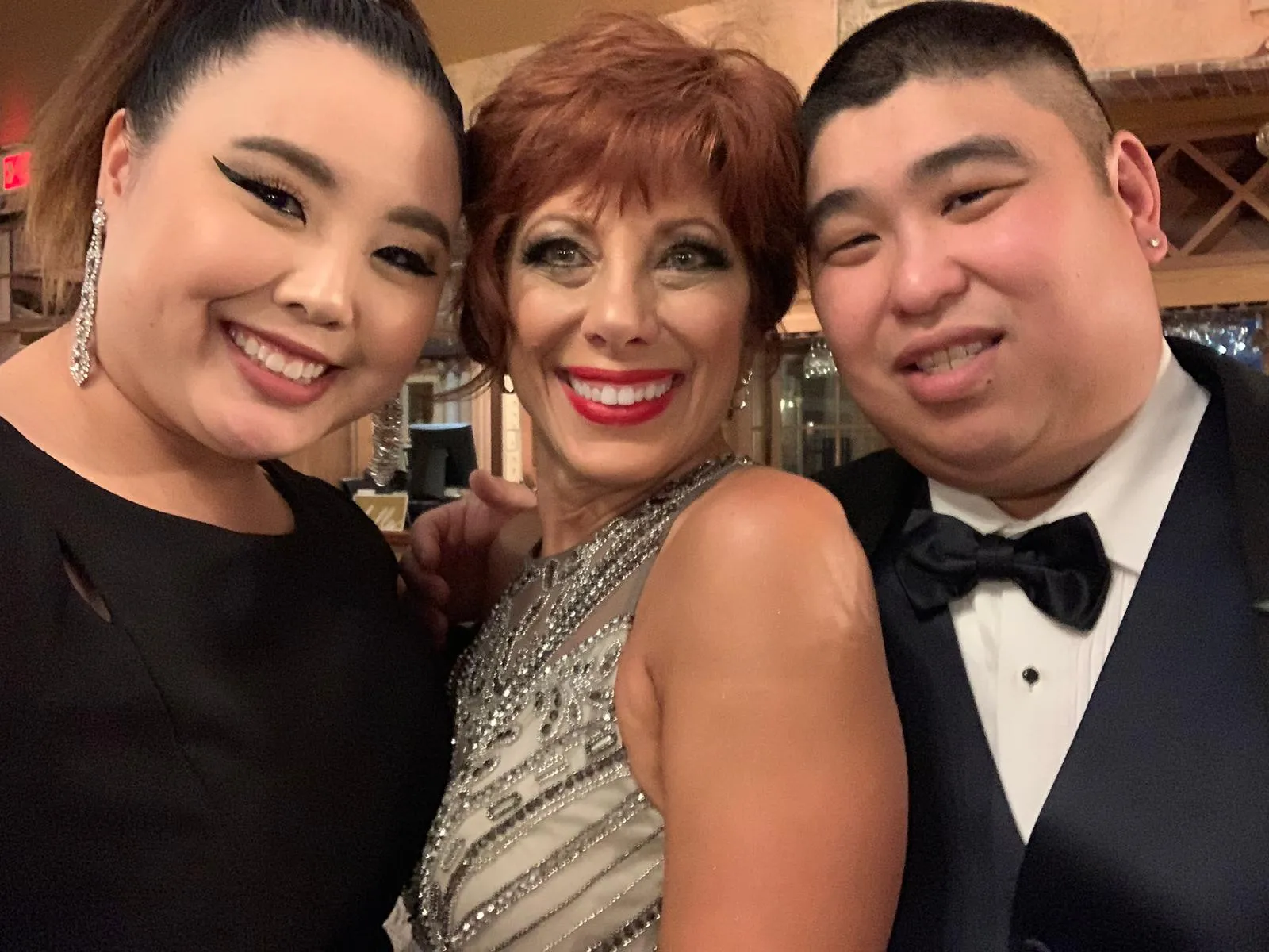 Lisa Maynard with adoptive daughter and son smiling together