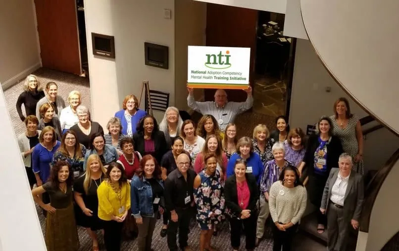 Annual-Advisory-Meeting-Group-with-NTI-Sign-USE_fixed-e1592994906756