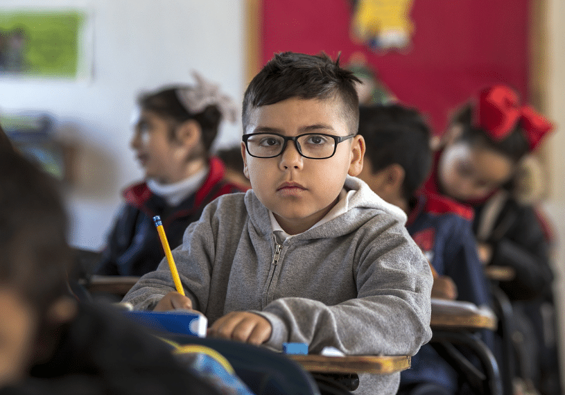 Young Boy Looking Serious in School