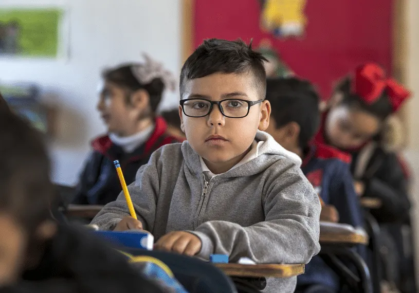 Young Boy Looking Serious in School