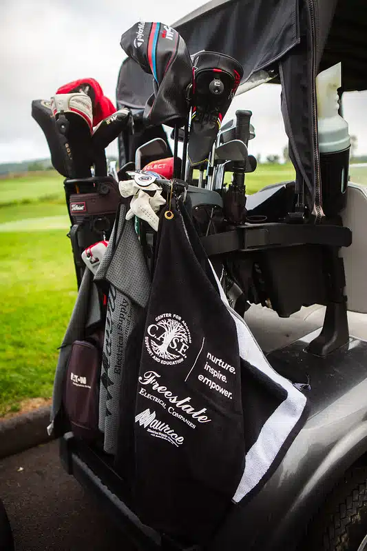 Golf Bag & C.A.S.E. golf towel featuring golf sponsor names