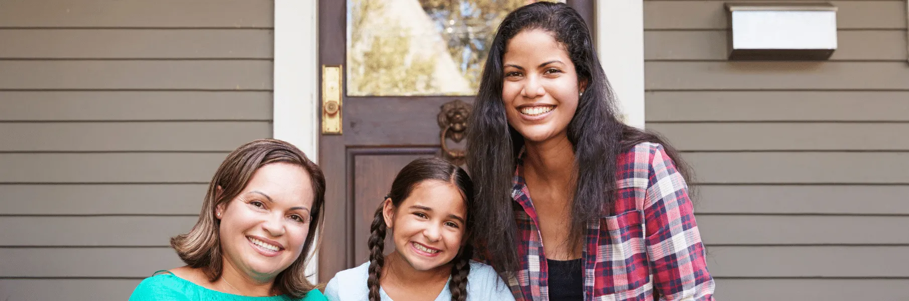 Hispanic women smiling with young girl