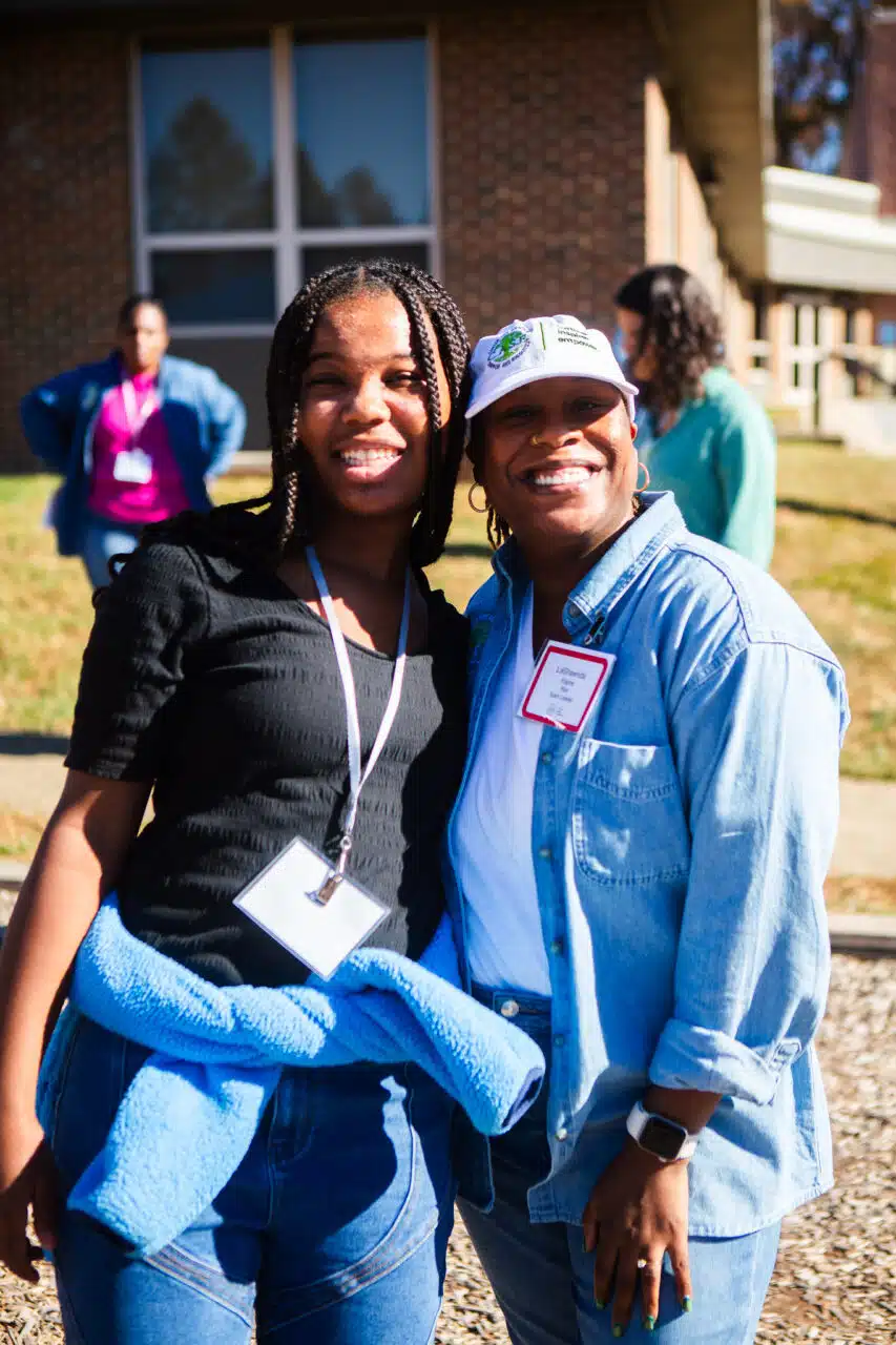 Teen Girl and C.A.S.E. Staff Member Smiling at KAN Conference 