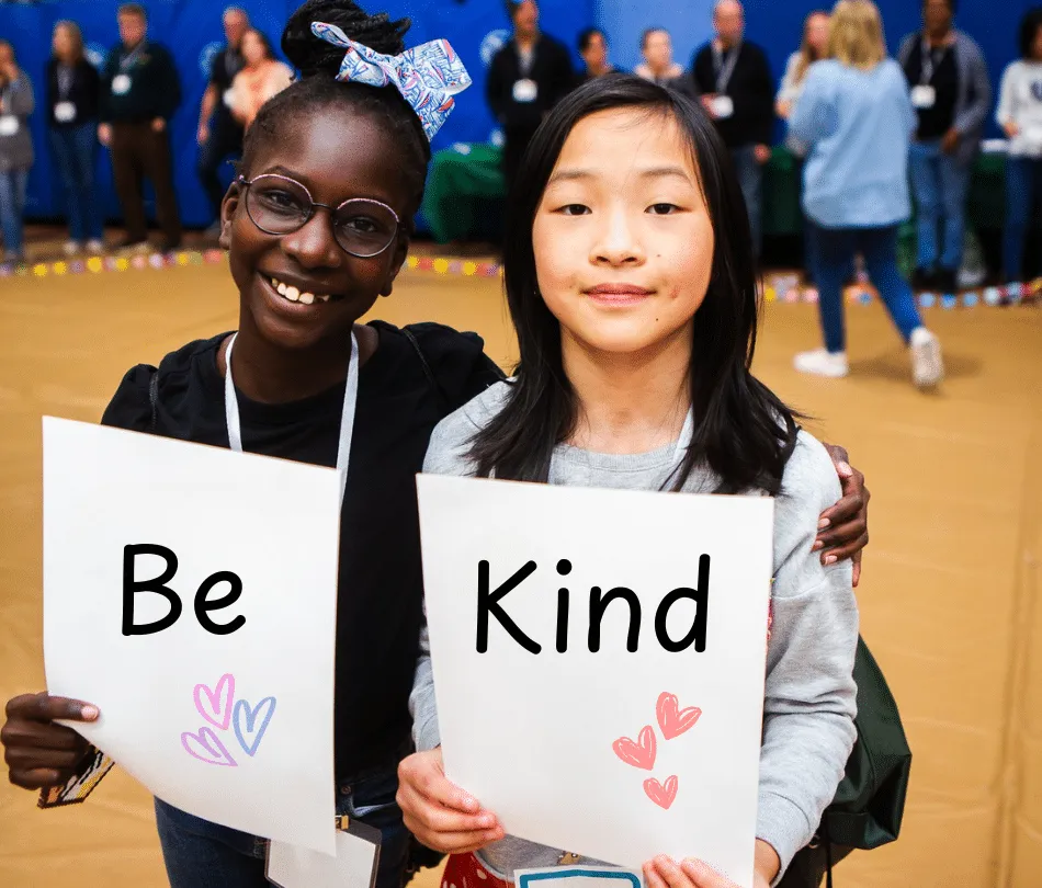 Young black girl holding sign 