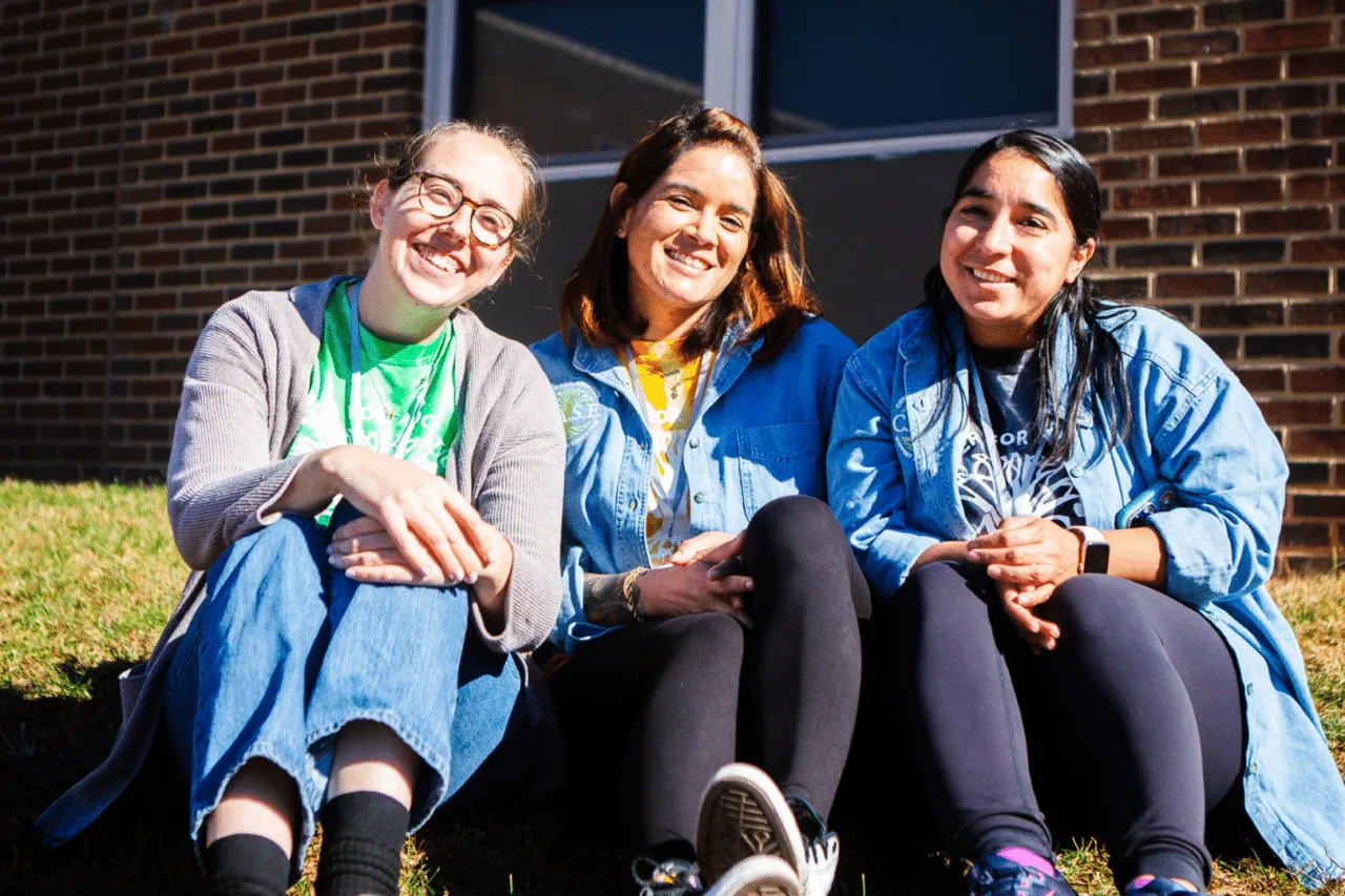Catey Yost & Rachel Shifaraw, Adult Adoptees, sitting outside smiling