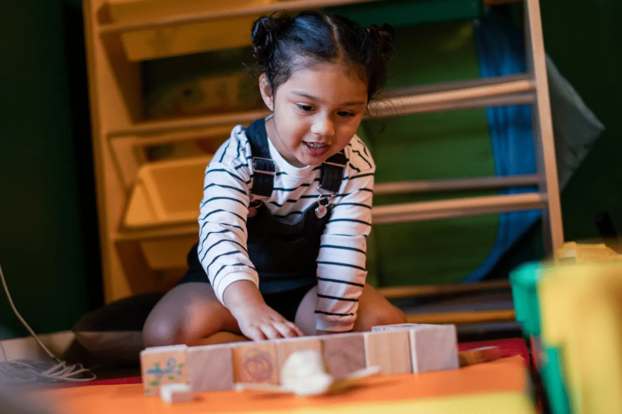 Young girl playing the toys